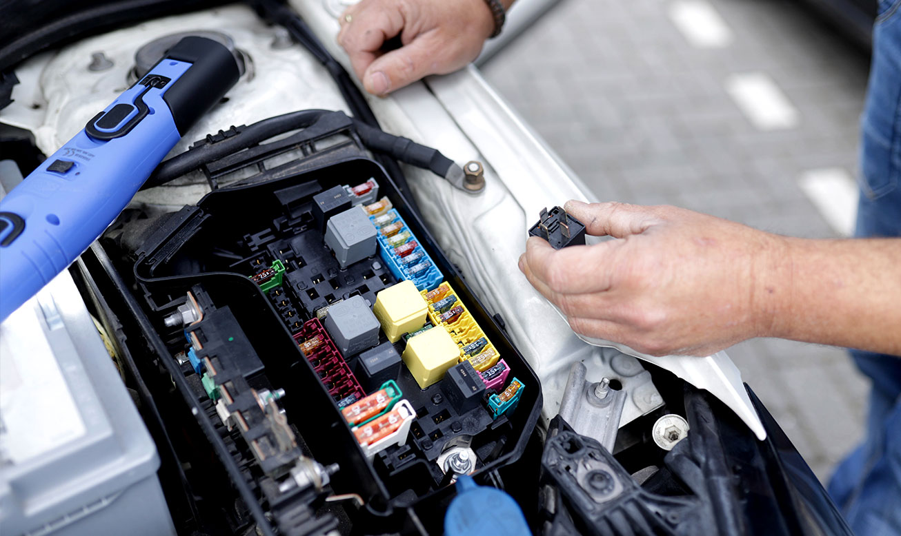 Mechanic Working on Car